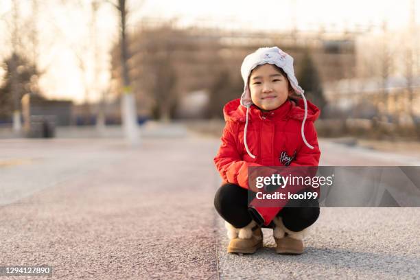 little girl in winter - girl wearing boots stock pictures, royalty-free photos & images