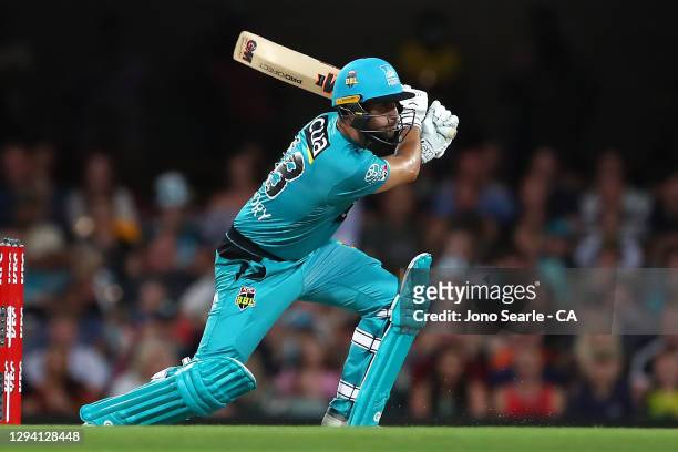 Lewis Gregory of the Heat plays a shot during the Big Bash League match between the Brisbane Heat and the Sydney Sixers at The Gabba, on January 02...