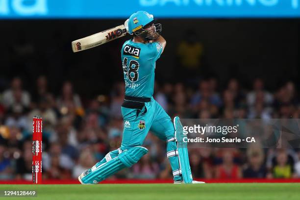 Lewis Gregory of the Heat plays a shot during the Big Bash League match between the Brisbane Heat and the Sydney Sixers at The Gabba, on January 02...