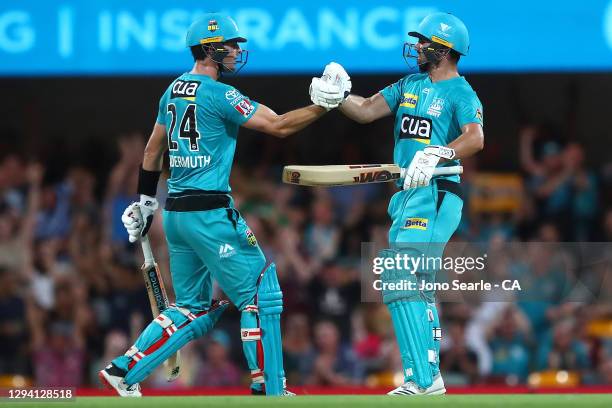 Jack Wildermuth and Lewis Gregory of the Heat celebrate the win during the Big Bash League match between the Brisbane Heat and the Sydney Sixers at...