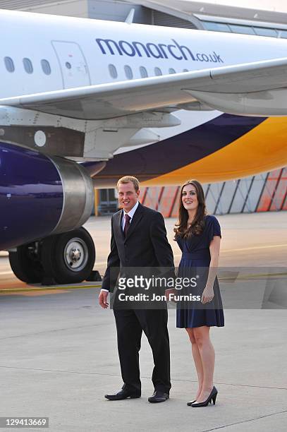 Prince William and Catherine Middleton look-a-likes board a Monarch Airlines plane as they celebrate the launch of planes branded with the personal...