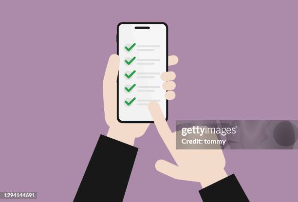businessman holds a mobile phone for a checklist - business-objectives-checklist stock illustrations