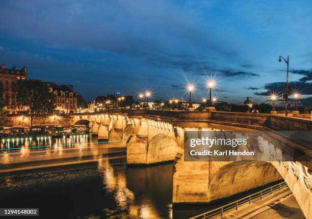 a night-time view of pont neuf bridge in paris, france - stock photo - pont neuf stock pictures, royalty-free photos & images