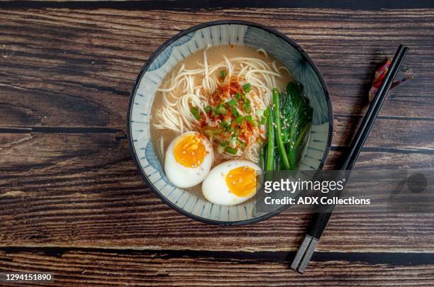 a bowl of ramen noodle with chopstick - ramen noodles stock pictures, royalty-free photos & images