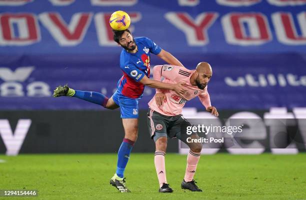 James Tomkins of Crystal Palace wins a header over David McGoldrick of Sheffield United during the Premier League match between Crystal Palace and...