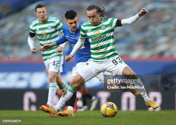 Ianis Hagi of Rangers vies with Diego Laxalt of Celtic during the Ladbrokes Scottish Premiership match between Rangers and Celtic at Ibrox Stadium on...