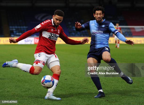 Marcus Browne of Middlesborough crosses the ball under pressure from Joe Jacobson of Wycombe Wanderers during the Sky Bet Championship match between...
