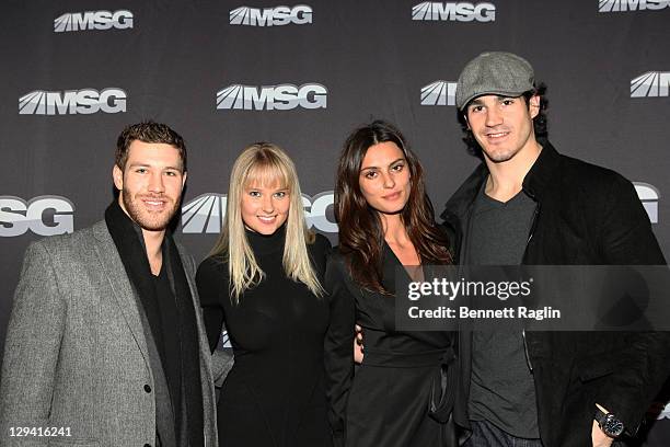 New York Ranger Brandon Prust, Genevieve Morton, Catrinel Marlon, and New York Ranger Brian Boyle attend the premiere of "The Summer of 86: The Rise...