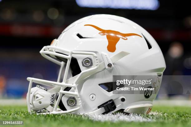 Texas Longhorns helmet is seen on the field before the Valero Alamo Bowl against the Colorado Buffaloes at the Alamodome on December 29, 2020 in San...