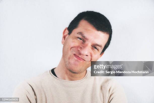 portrait of a man making a face at the camera - moue de dédain photos et images de collection