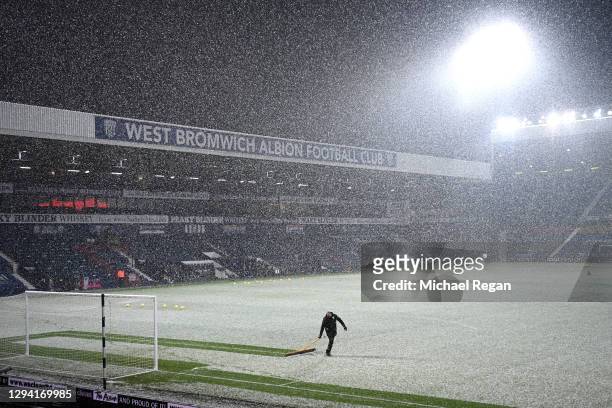 General view inside the stadium as snowfall is seen prior to during the Premier League match between West Bromwich Albion and Arsenal at The...