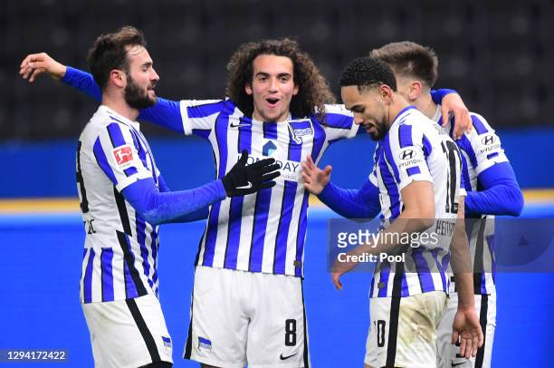 Krzysztof Piatek of Hertha Berlin celebrates with teammates after scoring their sides third goal during the Bundesliga match between Hertha BSC and...