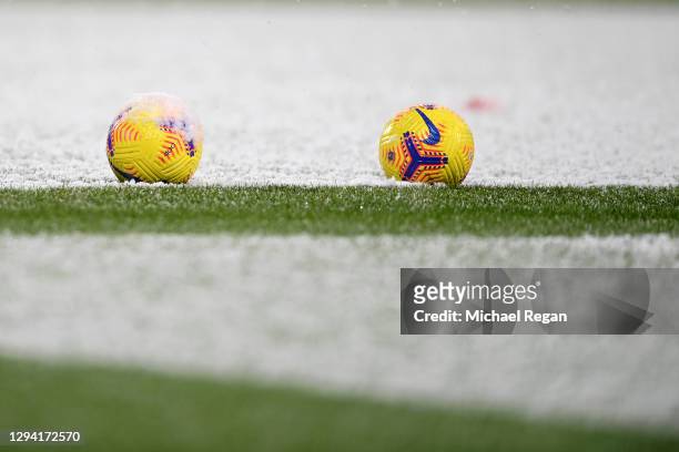 The Nike Flight Hi-vis winter match ball is seen in the snow prior to the Premier League match between West Bromwich Albion and Arsenal at The...