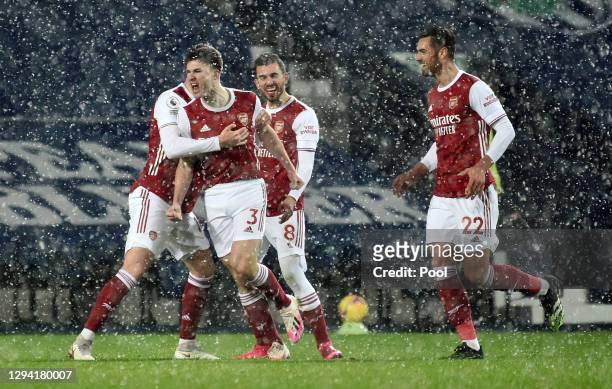 Kieran Tierney of Arsenal celebrates with teammates Rob Holding, Dani Ceballos and Pablo Mari after scoring their team's first goal during the...