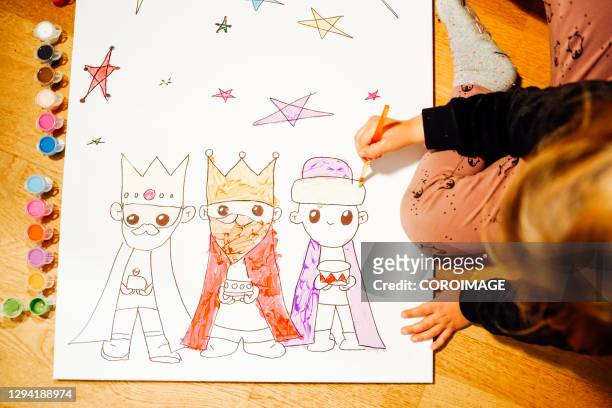 young girl painting the three kings. - three wise men stockfoto's en -beelden
