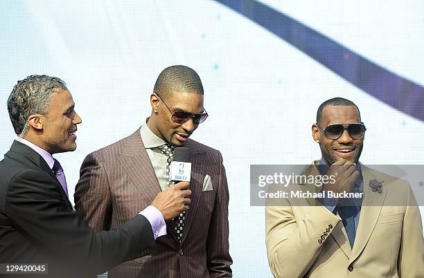 Former NBA player Rick Fox and NBA players Chris Bosh and LeBron James of the Miami Heat arrive at the T-Mobile Magenta Carpet at the 2011 NBA...