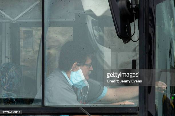 Bus driver is seen in Manly on January 03, 2021 in Sydney, Australia. Face masks are now compulsory in certain indoor settings across NSW as the...