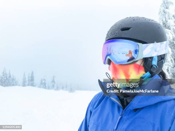 unrecognizable young woman skier wearing helmet, goggles and neck gaiter - buff stock pictures, royalty-free photos & images