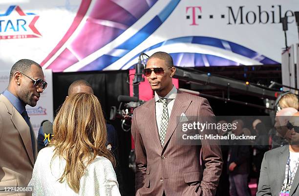 Player Chris Bosh and LeBron James of the Miami Heat arrive at the T-Mobile Magenta Carpet at the 2011 NBA All-Star Game at L.A. Live on February 20,...