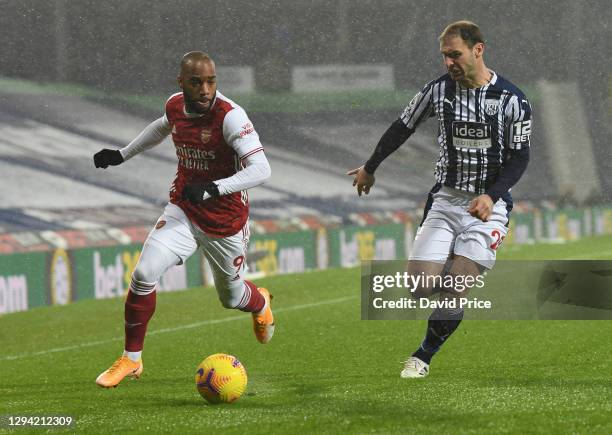 Alexandre Lacazette of Arsenal takes on Branislav Ivanovic of WBA during the Premier League match between West Bromwich Albion and Arsenal at The...