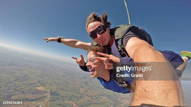 skydiving tandem selfie - skydiving stock pictures, royalty-free photos & images