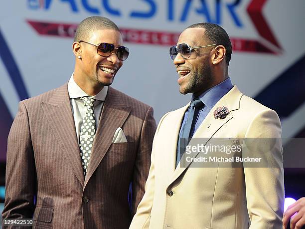 Player Chris Bosh and LeBron James of the Miami Heat arrive at the T-Mobile Magenta Carpet at the 2011 NBA All-Star Game at L.A. Live on February 20,...