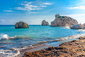 Aphrodite Beach with Stone Rocks in Aphrodite bay of Mediterranean sea water