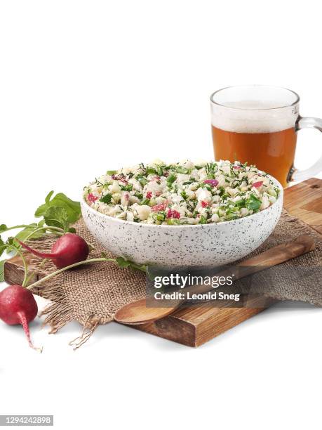 food photography of okroshka, traditional russian dish, a mixture of meat and vegetables with kvass, cold summer soup side view in a rustic style on a white background isolated close up. first course - salad bowl stock pictures, royalty-free photos & images