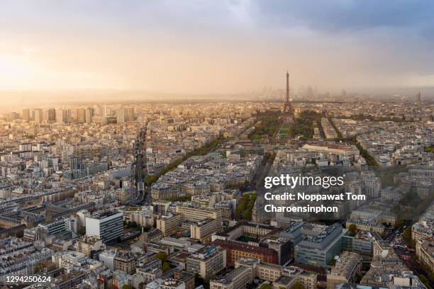 scenic view of paris cityspace during sunset - paris aerial stock pictures, royalty-free photos & images