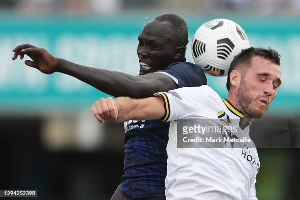Ruon Tongyik of the Mariners and Aleksandar Susnjar of the Bulls compete for a header during the A-League match between Macarthur FC and the Central...