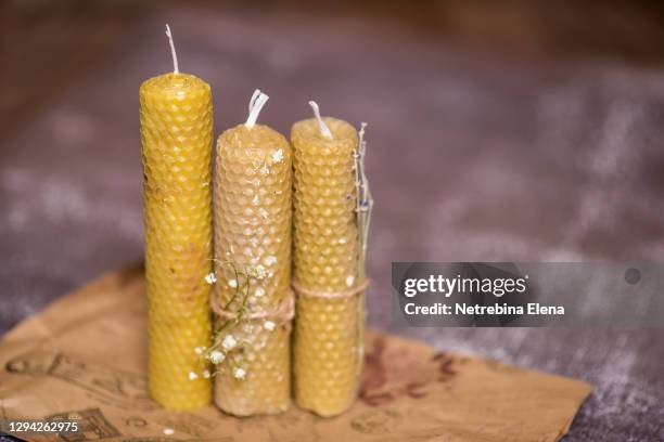 beautiful handmade beeswax candles. restoration of space, purification. aromatherapy. wax candles - beeswax stock pictures, royalty-free photos & images