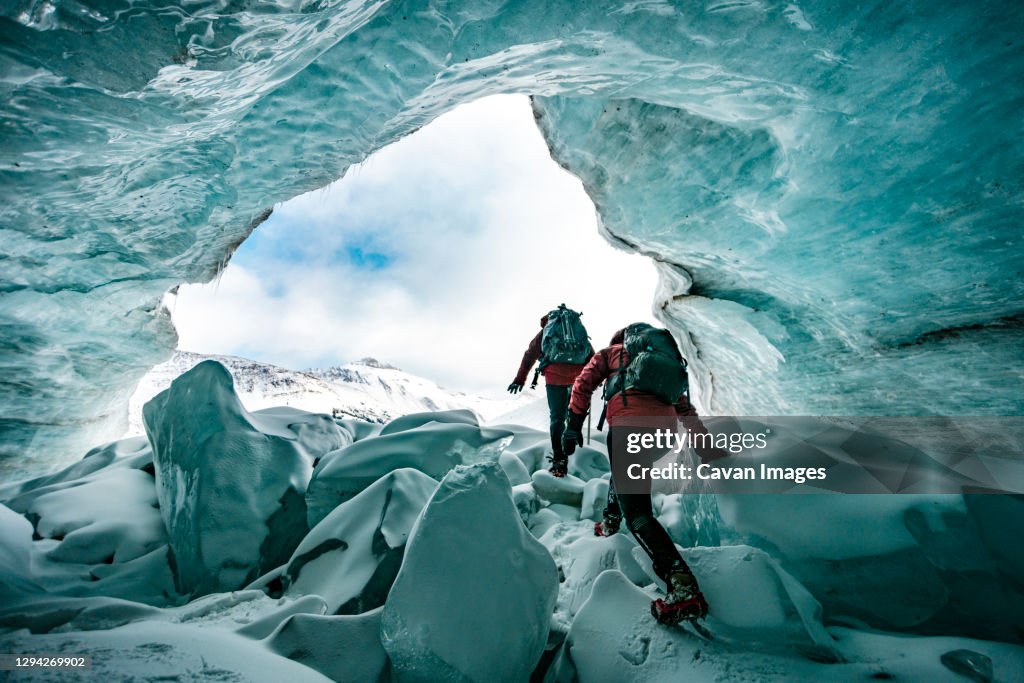 Mountaineers Exploring Inside Of Glaciers In Jasper