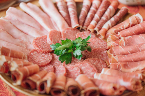 processed meats on platter - 飽和脂肪酸 ストックフォトと画像