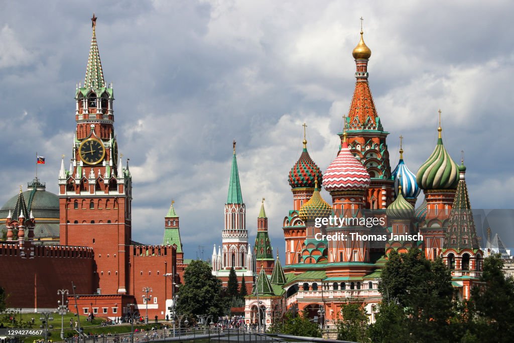 Saint Basil's Cathedral and the Moscow Kremlin with dark clouds approaching