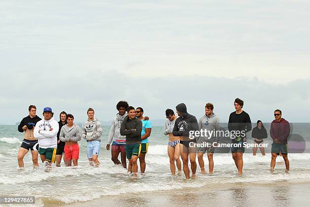 Wallabies players walk during an Australia IRB Rugby World Cup 2011 recovery session at Takapuna Beach on October 17, 2011 in Takapuna, New Zealand.