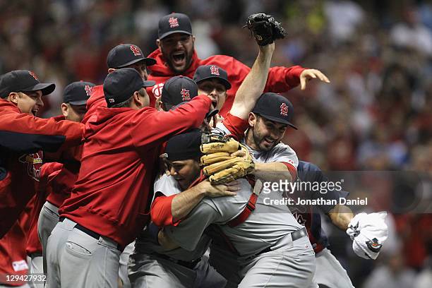 The St. Louis Cardinals celebrate after they won 12-6 against the Milwaukee Brewers during Game Six of the National League Championship Series at...