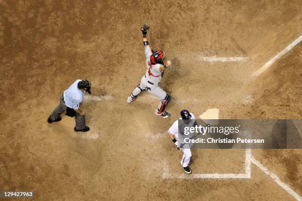 Catcher Yadier Molina of the St. Louis Cardinals reacts after Mark Kotsay of the Milwaukee Brewers for the final out of the Game Six of the National...