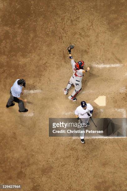 Catcher Yadier Molina of the St. Louis Cardinals reacts after Mark Kotsay of the Milwaukee Brewers for the final out of the Game Six of the National...