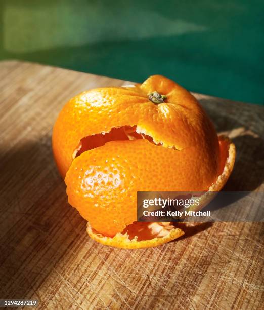 rustic orange peel - zitruszeste stock-fotos und bilder