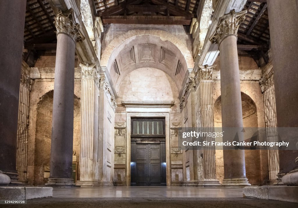 Close up image of the Rome Pantheon facade with ancient Roman gate illuminated at night in Rome, Lazio, Italy
