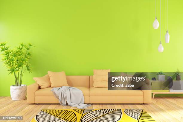 modern living room with sofa and green wall - bright colour room stock pictures, royalty-free photos & images