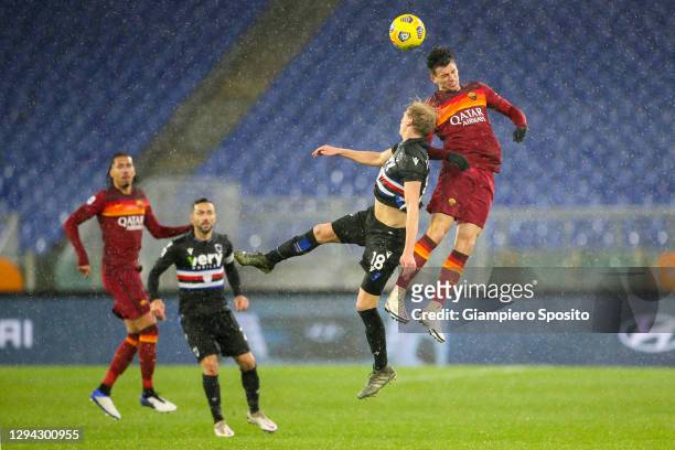 Morten Thorsby of UC Sampdoria and Roger Ibanez of AS Roma jump for the ball during the Serie A match between AS Roma and UC Sampdoria at Stadio...