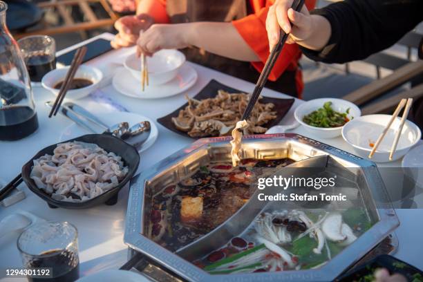 friends having a hot pot meal together - lancashire hotpot stock pictures, royalty-free photos & images