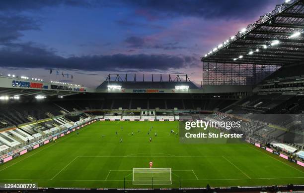 General view of the sun setting behind St James' Park, from the Leazes end of the stadium during the second half of the Premier League match between...