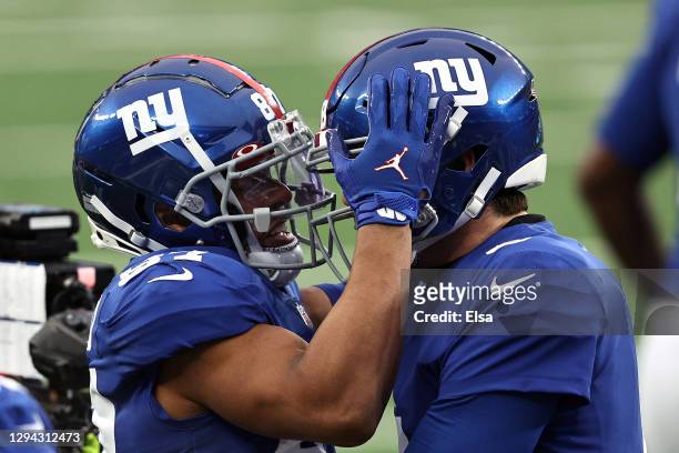 Sterling Shepard of the New York Giants is congratulated by Daniel Jones after scoring on a 23-yard rushing touchdown against the Dallas Cowboys...