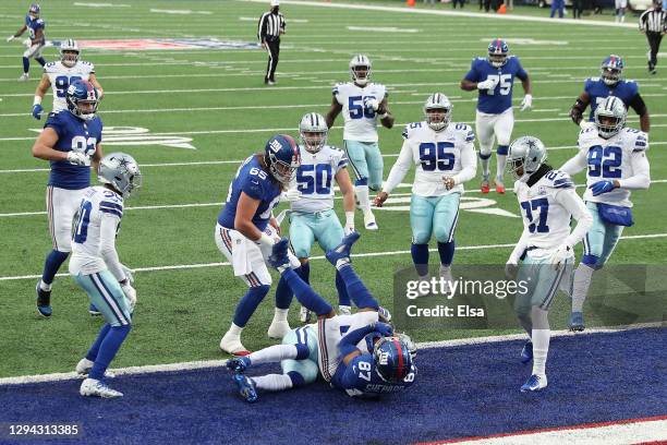 Sterling Shepard of the New York Giants scores on a 23-yard rushing touchdown against the Dallas Cowboys during the first quarter at MetLife Stadium...