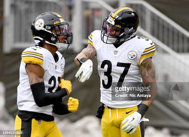 Justin Layne and Jordan Dangerfield of the Pittsburgh Steelers react in the first quarter against the Cleveland Browns at FirstEnergy Stadium on...