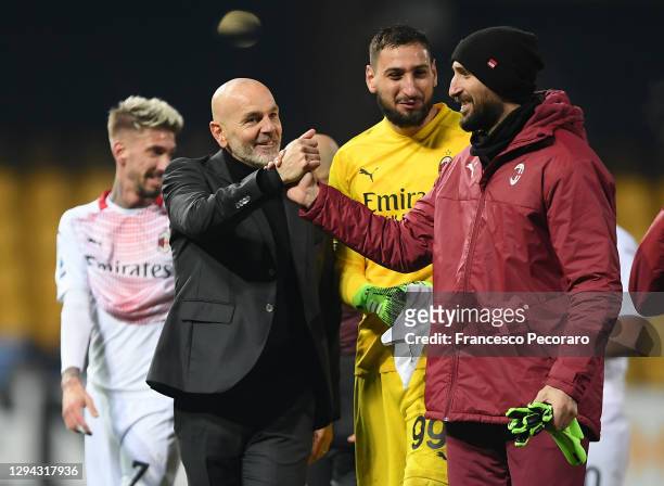Stefano Pioli, manager of AC Milan celebrates victory with team mates Gianluigi Donnarumma and Antonio Donnarumma during the Serie A match between...