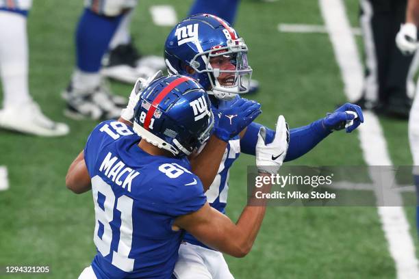 Sterling Shepard of the New York Giants is congratulated by Austin Mack after scoring a ten-yard touchdown reception against the Dallas Cowboys...