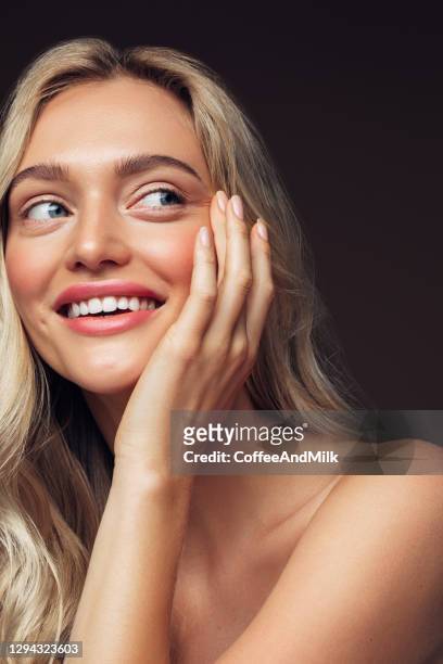 portrait of a nice looking woman - glowing skin stock pictures, royalty-free photos & images